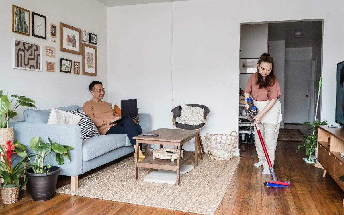 a Woman Vacuuming in a Living Room